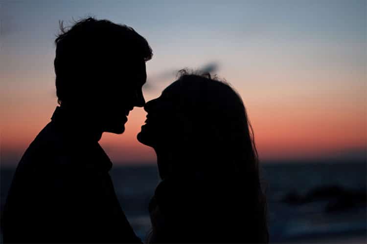 Silhouette of Couple Kissing during Sunset · Free Stock Photo